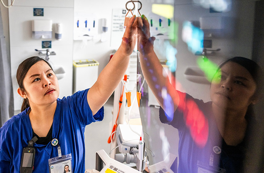 A Cleveland Clinic Caregiver looking at a screen.