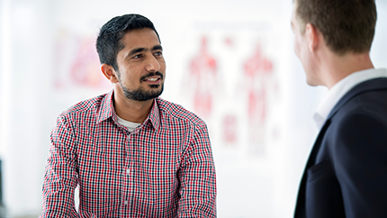 Cleveland Clinic London caregiver and patient having a conversation.