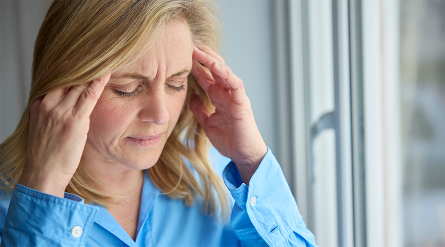 A woman holding her temples