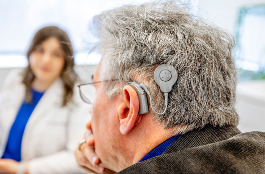 Consultant and patient with cochlear implant.