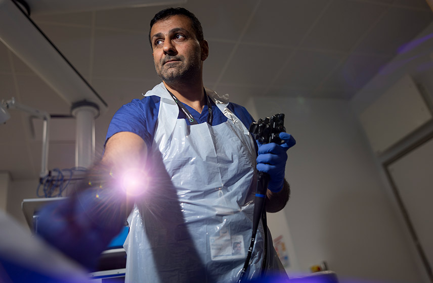 Doctor holding an endoscopy scope.