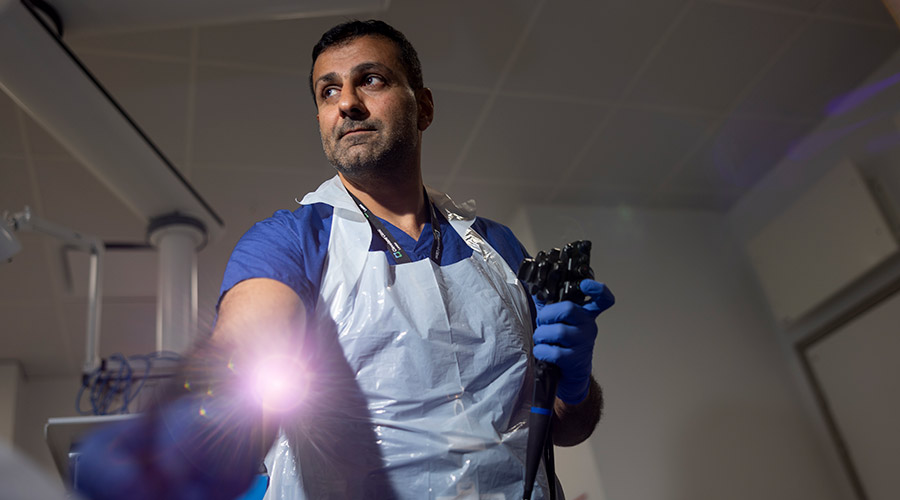 Doctor holding an endoscopy scope.