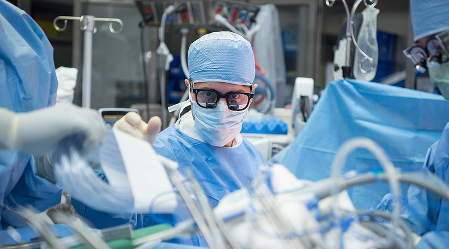 A caregiver performing gallbladder surgery.
