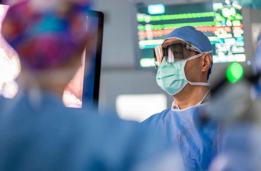 Surgeons performing digestive surgery in the operating room.