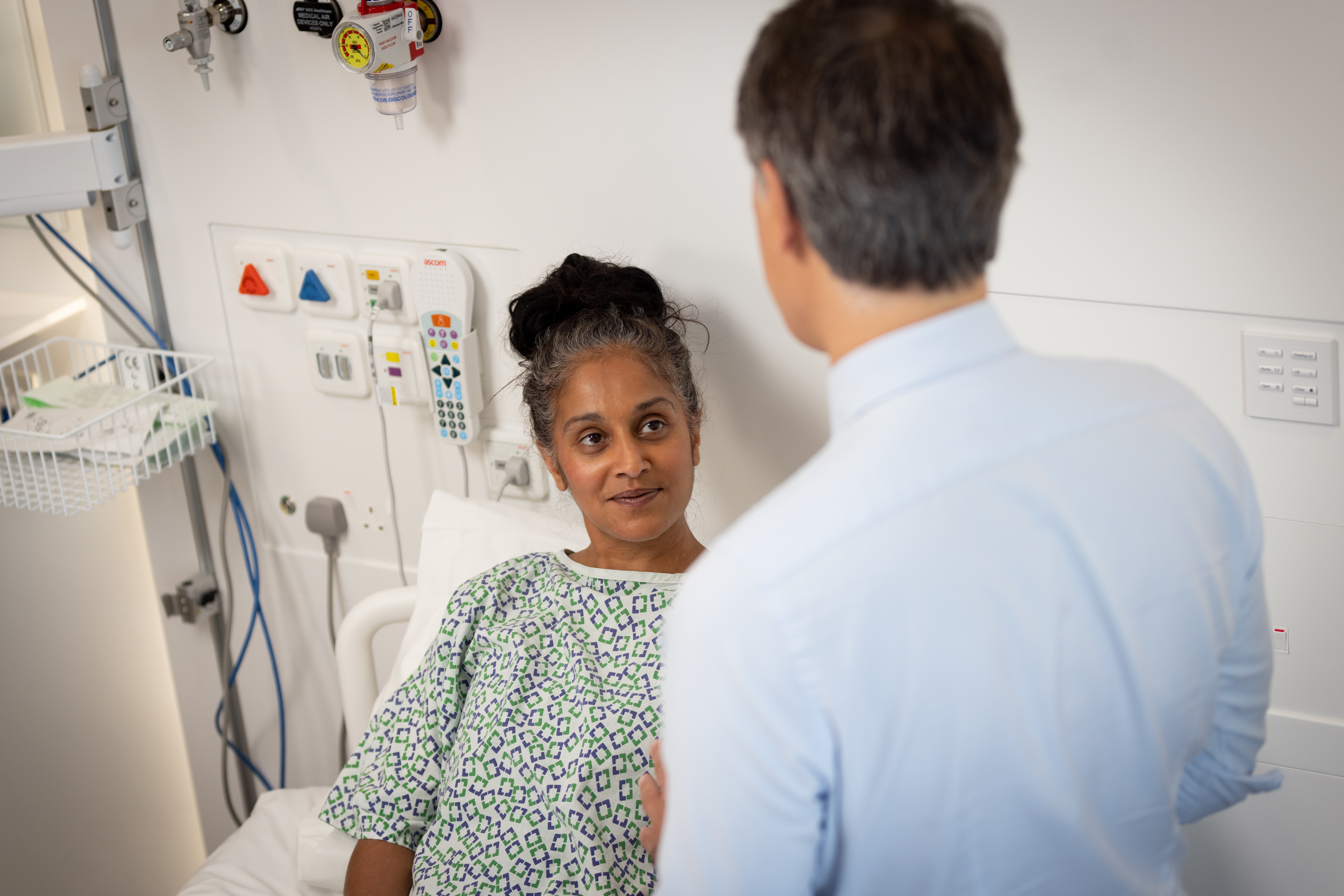 Caregiver talking to pancreatic cancer patient