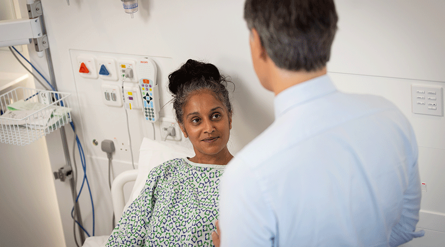 Caregiver talking to pancreatic cancer patient