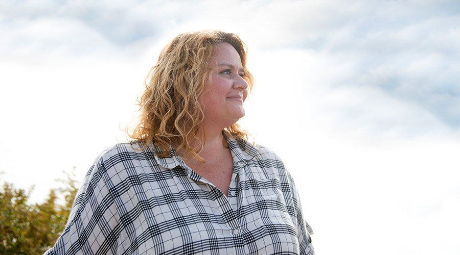 Woman standing outside.