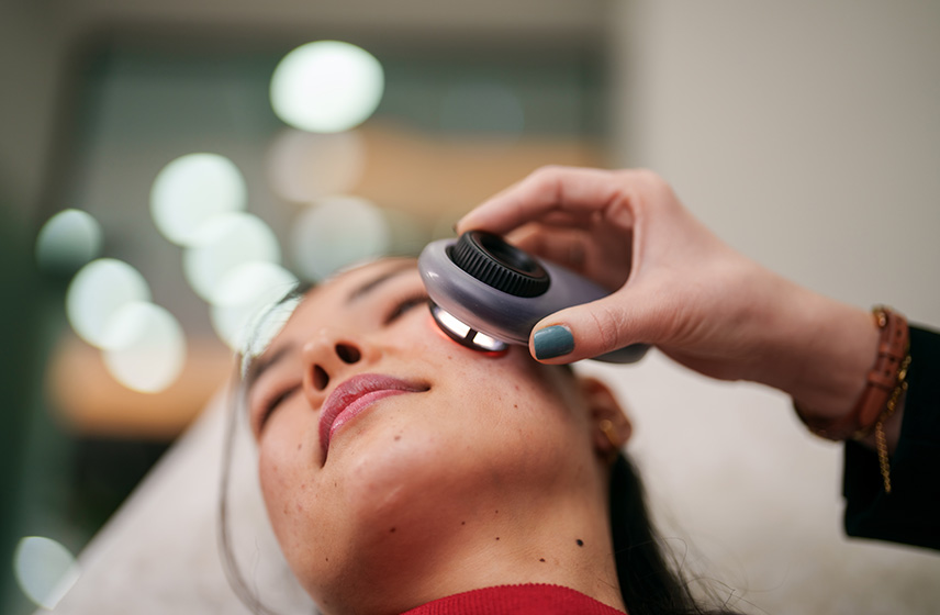 A Cleveland Clinic caregiver examining a patient's skin.