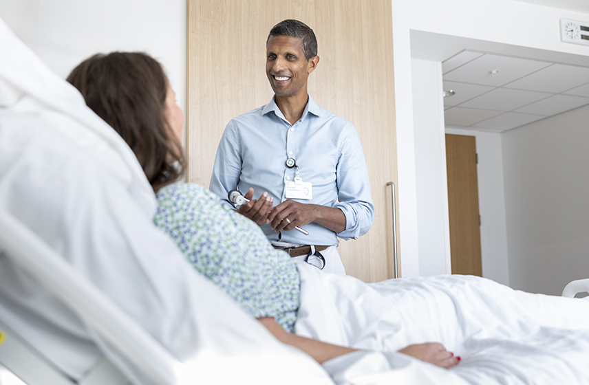 London consultant Dr Arvind Chandratheva talking with a patient