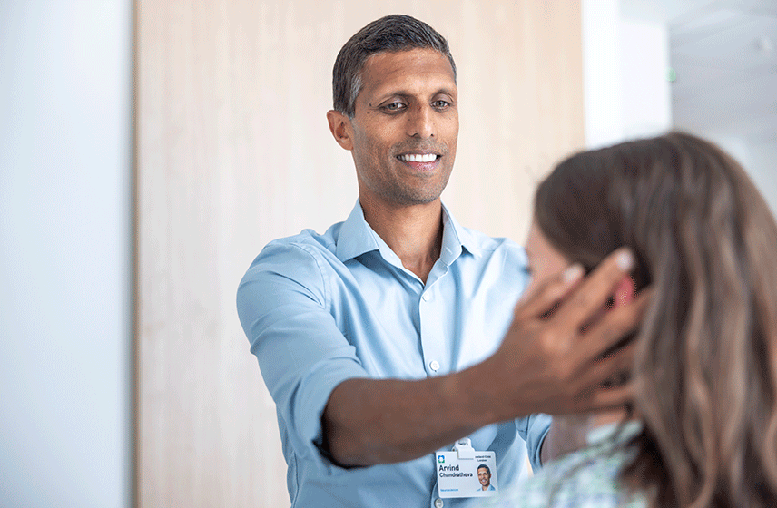 Consultant examining a patient's head.
