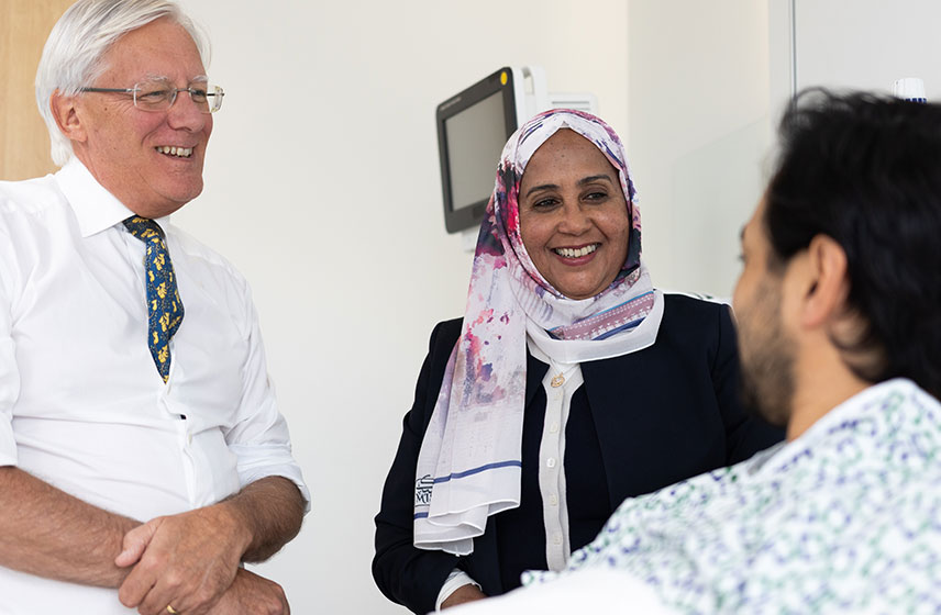 Cleveland Clinic consultants meeting with a patient about hip revision options.